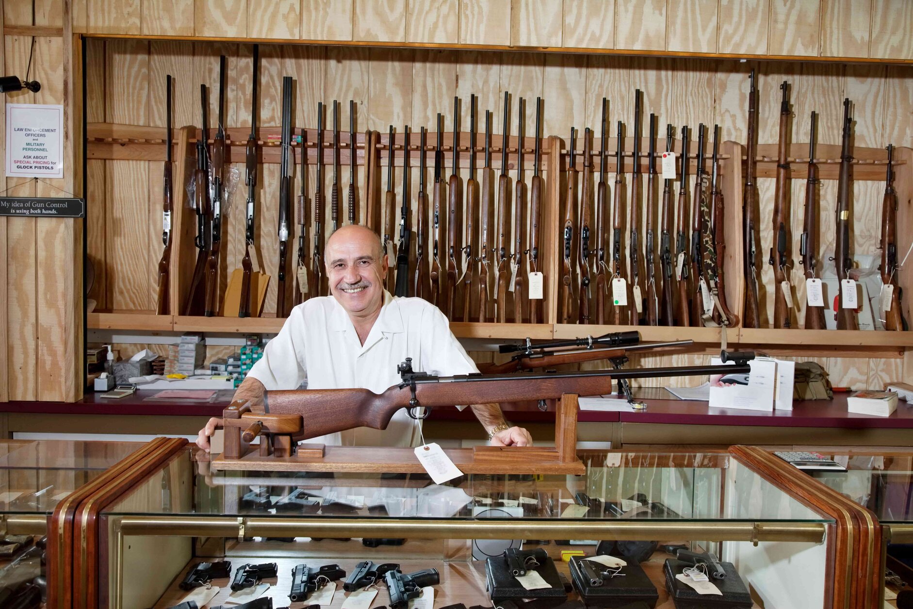 happy gun shop owner