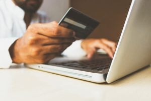 man making an online card payment