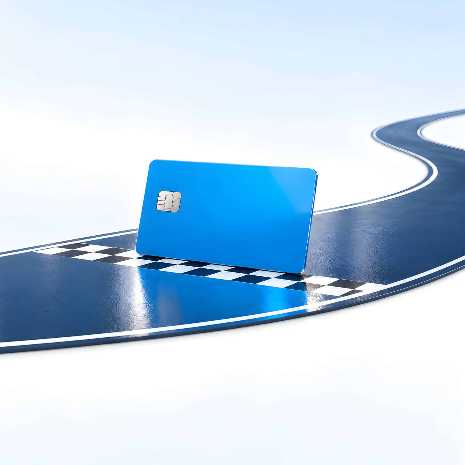 A blue payment card crossing a checkered finish line, the idea behind payment processing for collection agencies at Payment Savvy